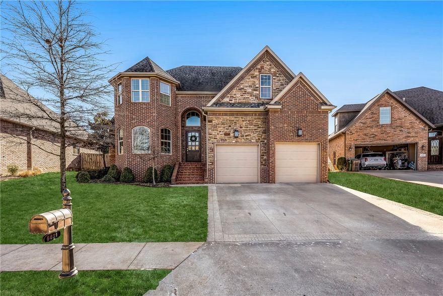 Welcome home to this immaculate 5 bed/4 ba 1 owner home in the prestigious gated community of Shadow Valley, located near all NWA has to offer!  This inviting home features soaring 20' ceilings, an open living room leading to a chef's kitchen with removable butcher block in the center island and built in professional fridge & freezer, a 6'x16' hidden pantry, and a private primary suite on the main floor including integrated speakers in the primary bedroom and living room.  Upstairs feature a split floor plan with 4 bedrooms, one which could be used for a media or bonus room, 2 full bathrooms, and an added flex room with beautiful built-ins and added storage under the day bed.  The backyard features a covered patio and full privacy with no neighbors behind you.