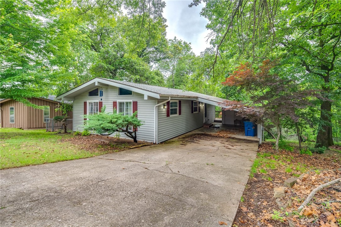 Escape the city to your cottage in the woods. This 2 bedroom, 2 bath home has all the character in charm you home to find in a Bella Vista lake style home. New water heater and fireplace insert. Walk out to your deck, sit back and look over your large yard. There are plenty of mature trees and space to entertain. Hot tub does not work. Seller will not be making any repairs.This street ends in a cul-de-sac so minimal traffic. Easy access to the center of Bella Vista and the Walmart in Jane.