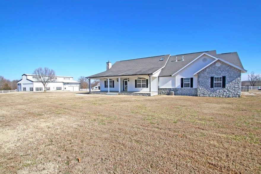 BEAUTIFUL COUNTRY HOME ON FABULOUS 12.63 ACRES boasts a peaceful and pristine setting complete with a 100x200 fenced riding arena, a 6-stall insulated barn with full bath & tack room, a 3-stall run-in horse barn & hay storage, and a 2,442 SQ FT shop with 1,258 SQ FT finished apartment. 2,938 SQ FT main home offers 4 bedrooms, 4 full baths, & large wrap around covered patio.