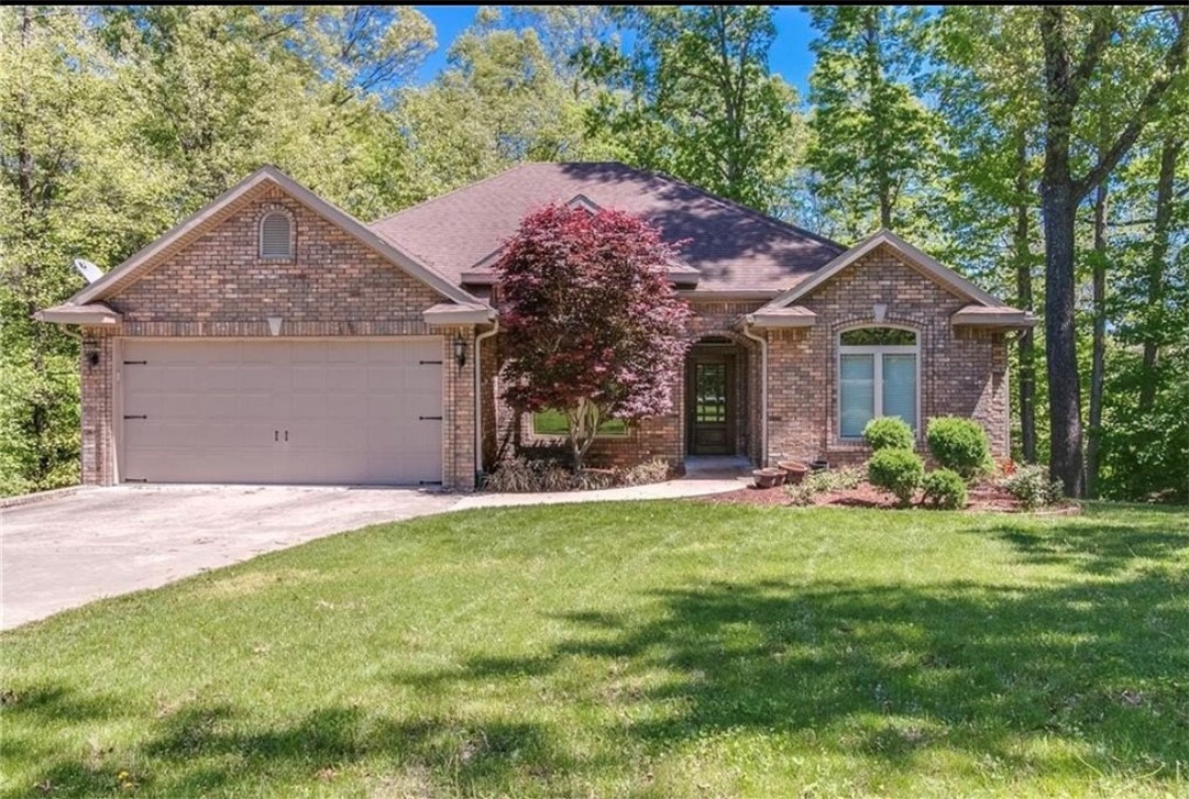 No better way to enjoy AR living than this charming all-brick home with 3 BDRs, 3 full BAs, and a finished w/o basement. In Bella Vista, known for its outdoor recreation and scenic beauty. In the amenity-rich neighborhood of Branchwood, home near golf, lakes, and rec center. Floor plan brings the outdoors in through itsā generous 7ā tall windows. Crown molding, custom cabinets and woodwork, and recessed lighting throughout. Chefās kitchen boasts granite counters, tile backsplash, island, SS appliances incl a 36ā gas range. Breakfast nook is perfect for morning coffee. Cozy gas fireplaces on BOTH LEVELS of this homeās 2 family rooms! Located on main floor is laundry, formal dining room, office and 2 split BDRs; primary BDR w/ tray ceiling, BA w/ walk-in shower, dual vanities, walk-in closet. W/O basement has family room, wet bar, 3rd BDR, BA and bonus room. Enjoy stepping out to either of your 2 patios or deck for views of your private backyard. You will feel like you are on vacation every day!Home is a MUST SEE!