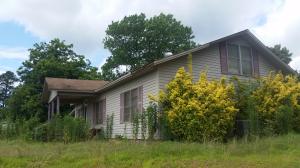 12 ACRES WITH 3 BEDROOM 2 BATH HOME THAT JOINS DELTIC TIMBER LAND. THIS HOME IS IN NEED OF SOME TLC BUT OFFERS LOTS OF SPACE FOR YOUR FAMILY. THERE ARE SEVERAL OUTBUILDINGS AND AN OLD CHICKEN HOUSE THAT CAN BE USED FOR STORAGE.