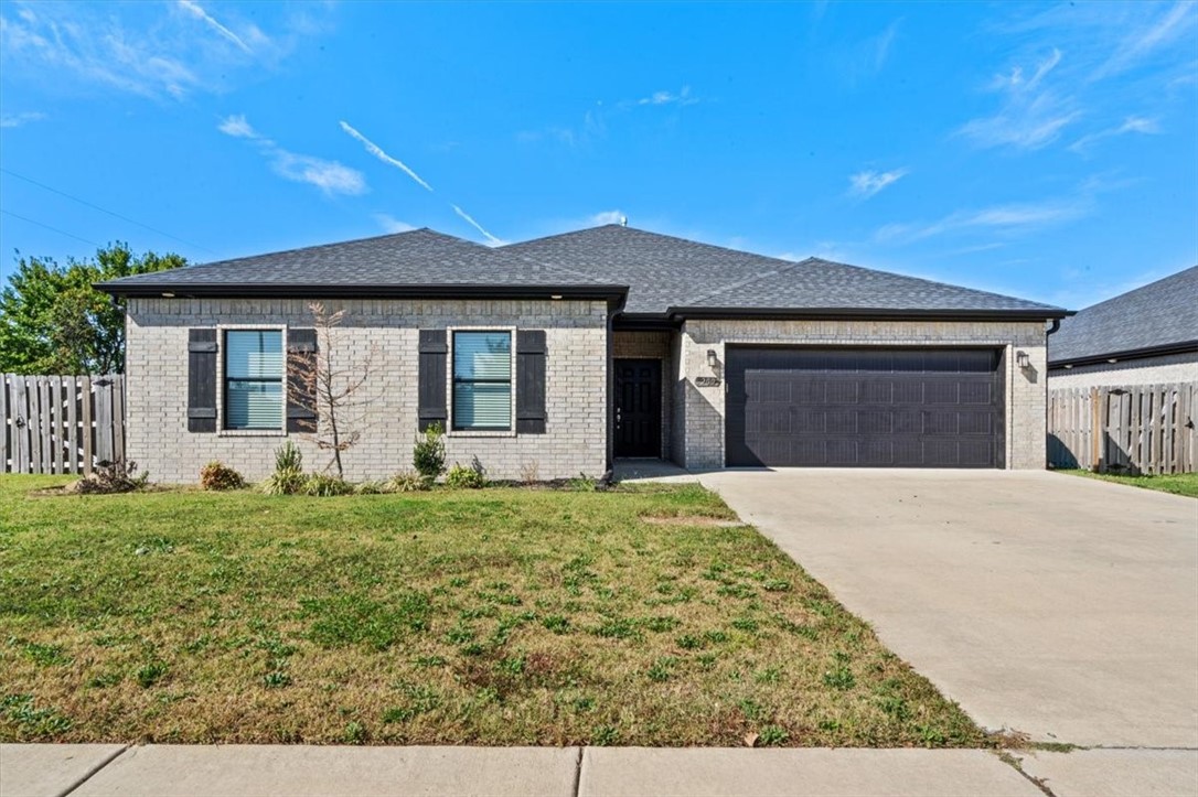 Welcome to 200 Tricha Circle, a stunning 2022-built all-brick home in the desirable new subdivision of Gravette, AR! This well-maintained gem boasts a spacious open-concept kitchen, dining, & living area, perfect for entertaining. The large master suite offers privacy with a split floor plan & walk-in closet. The beautiful kitchen features granite countertops, custom wood cabinetry, & a pantry for added convenience. Enjoy the ease of LVP flooring throughout. Situated on a corner lot, the fully fenced backyard provides a secure space for outdoor activities. Located in a growing neighborhood, this home combines modern finishes with comfort & functionality. Don’t miss your chance to own this beauty!