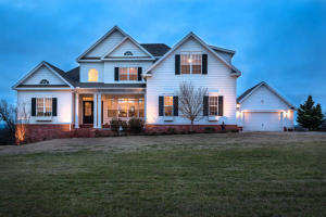 Custom Built home on 15 acres surrounded by large acreage which creates in-town living with country privacy including 1/2 mile drive-way. Interior and exterior upgrades include 19' ceiling and a kitchen featured in national home magazines. Built in 2007, the home has just gone through a refreshening and feels like a brand new home again. You will fall in love with the open floorplan, and the spacious rooms! The home was designed to entertain, but still has that warm cozy feel allowing you to come home after a busy day and unwind in peace and quiet. The home is in city limits but is zoned Agri allowing you to enjoy some cattle, or horses. This is really one of those homes that you need to come an Try On...I promise you will love the way it feels!