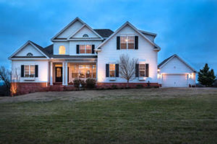 Custom Built home on 15 acres surrounded by large acreage which creates in-town living with country privacy including 1/2 mile drive-way. Interior and exterior upgrades include 19' ceiling and a kitchen featured in national home magazines. Built in 2007, the home has just gone through a refreshening and feels like a brand new home again. You will fall in love with the open floorplan, and the spacious rooms! The home was designed to entertain, but still has that warm cozy feel allowing you to come home after a busy day and unwind in peace and quiet.  The home is in city limits but is zoned Agri allowing you to enjoy some cattle, or horses.  This is really one of those homes that you need to come an Try On...I promise you will love the way it feels!