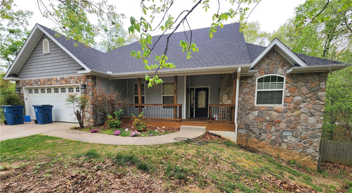 Huge price drop! This is is now priced to sell fast. Fantastic Bella Vista location just 1 mile west of Allen’s Grocery & 71B, and only 5 minutes from Bentonville! Close to the new BV Trail-Head, this spacious 2,607 SF home offers great potential with a little TLC. Main living is on the first floor, with two guest bedrooms split from the master suite. A large bonus room downstairs offers flexibility as a 4th bedroom or office. The home features beautiful custom cabinets, granite countertops, a gas log fireplace, and a generous master suite with whirlpool bath. Outside, you’ll find a back deck overlooking the back yard, and a small deck that can be used for a hot tub, gondola or barbeque area within the privacy fence. Open concept living/kitchen area ready to shine with your personal touch! Near new chairlift being built along Oldham Road.