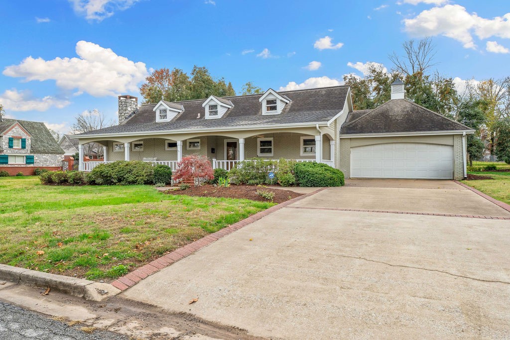 Outstanding location, great established neighborhood. Less than 10 minute walk to downtown. Schools, trails, various restaurants and shopping are conveniently close. This property is professionally landscaped and almost one half acre in size. It features a large covered front porch for family, friends to enjoy, as well as a new, long lasting composite deck in back yard. Inside you will find some vintage hardwood floors along with updated granite countertops and soft close kitchen cabinet doors, A bedroom and full bath are located on both sides of the hallway. The 2 car garage has additional storage as well as back yard access. Sprinkler system NEW. This delightful property has been owned and cared for by the same family for several decades. What a wonderful opportunity to start making unforgettable family memories of your own in a very special and desirable location.