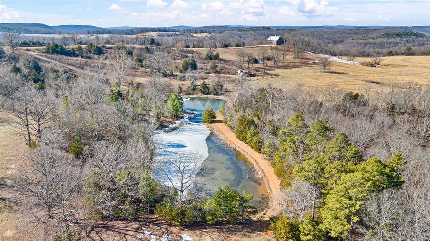 This is a once in a lifetime opportunity! The Snowlick Mountain Ranch includes 317.78 Acres and Panoramic views for miles. With roughly 100 Acres of manicured fields, 4 ponds and the remaining prime hunting ground with napier creek running along the southern border. This tract was previously a high fence ranch with miles of 8 foot fence still remaining. The Brand New Custom built (Timber Frame) Cabin is like something you'll only see from a magazine. Every Log, board and Peg that built this Cabin was harvested from this property, it's so incredible to see the craftsmanship and perfection that went into this build. The Cabin is 5,600 Sqft Heated and Cooled with the garage area included. Upstairs in the main living area is 2,800 Sqft 2 Bedrooms and 3 Full bathrooms. THIS WILL NOT LAST LONG!