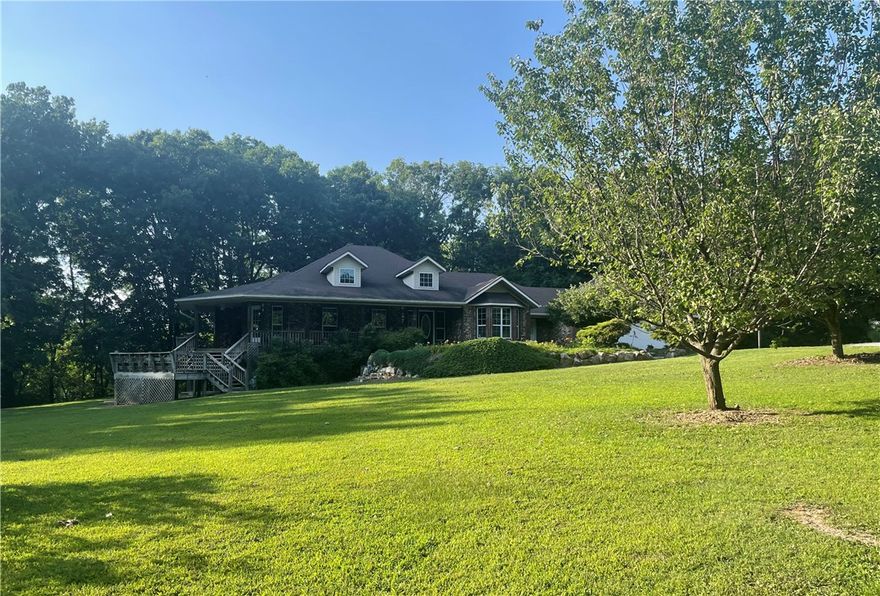 Outdoor enthusiasts dream property! Plentiful deer for hunting or just to watch them; fish in the private lake; or four wheeling on this large acreage! This very unique and beautiful custom built home on 54.72 +/- Acres is very private and ready for you to move into! Four bedrooms & 3 1/2 baths, Large hobby room on main level and game room on bottom level! This lovely home has mostly hardwood floors and large rooms. Kitchen has many cabinets with two ovens. Two sided gas fireplace in the living room! The exterior of the home has brick and rock taken from the property itself! Many of the rocks have fossils hand picked by the owners! Part of the property includes a beautiful two acre spring fed private lake!! Also is a 1,500 sqft craftsmans dream shop building. Inside the shop is a 400 sqft apartment! The exterior of the shop is brick and rock to look like the house (no typical metal building here! Also on the property is a large pole barn to keep your equipment!