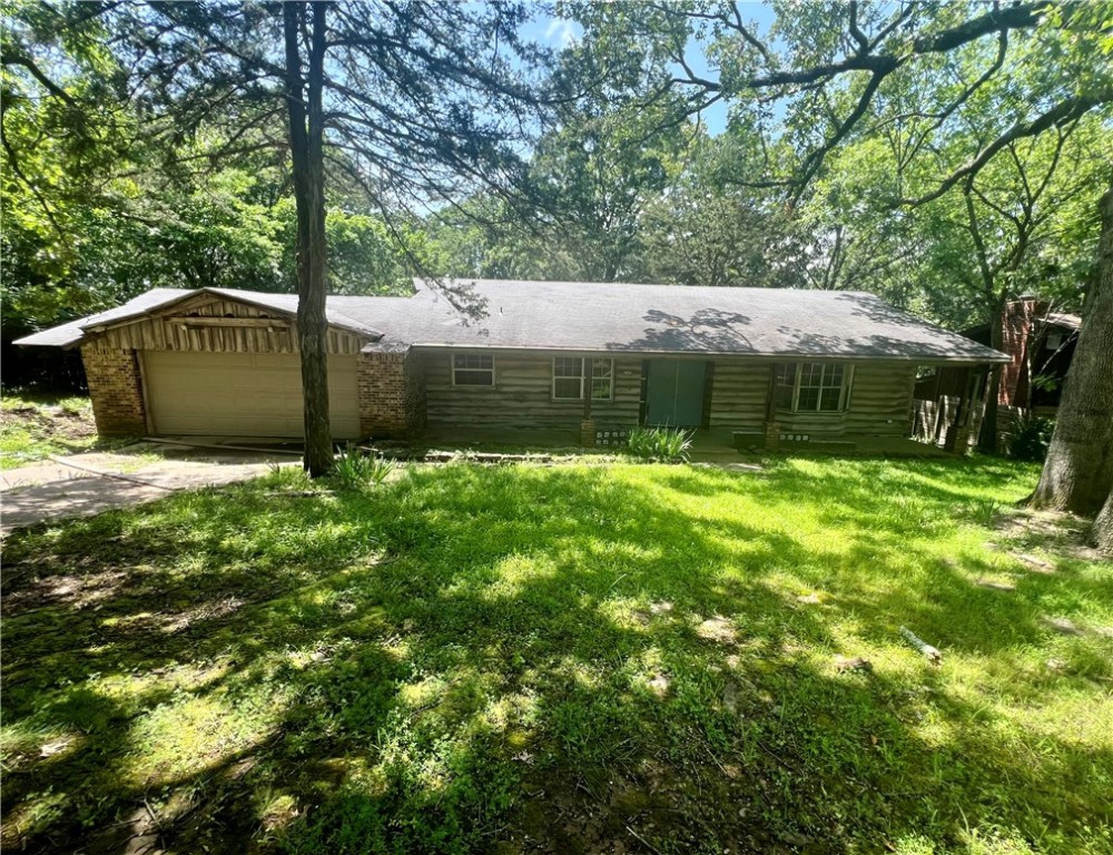 Fixer-Upper on Mt. Sequoyah! This tri-level home on the backside of Mt. Sequoyah offers a rare opportunity in a highly desirable location. Bring your vision to life—imagine refinished hardwood floors and natural light filling the living room. With endless potential, this home is perfect for a custom renovation. Owner financing potential at list price. Open to all offers—don’t miss out on this incredible opportunity! NO SPD. Sold AS-IS!
