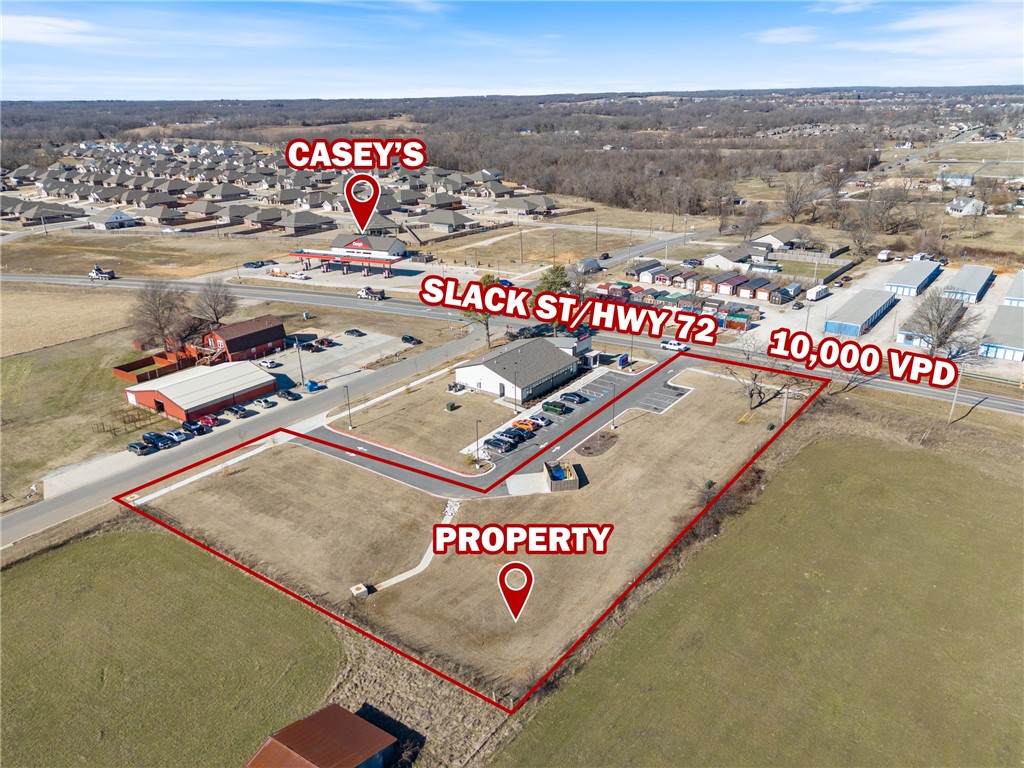 This +/- 1 acre lot on Highway 72 in Pea Ridge offers a prime location for your next commercial venture. Zoned C-2 General Commercial, this property is ideal for a variety of uses, including a specialty medical facility, pharmacy, quick-service restaurant (QSR), restaurant, coffee shop, general office/retail building, and more. Conveniently located caddy-corner to the brand-new Casey's General Store and just 12 minutes from the new Walmart Corporate HQ, which is set to begin opening this year, this lot offers excellent visibility and accessibility. It's also situated next door to Pea Ridge Urgent Care. With electric and water services already available on-site, this property is ready for your vision.