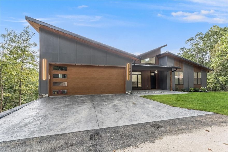 Come home to this truly remarkable modern home with seasonal views of Lake Windsor. Featuring unparalleled craftsmanship, custom trim features throughout, a spacious and open floor plan, 23 Wembly was designed to impress. The soaring ceilings and plentiful windows of the main level offer expanded natural light, while the custom features of the chefs kitchen will delight the senses. A second downstairs living room and kitchenette offer expanded options for living space. Offered below the recent appraisal of $850,000. Just steps away from local mountain bike trails and Lake Windsor. Come see this Bella Vista show stopper today.