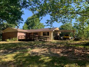 Have you been looking for a private, tucked away home on the outskirts of town, with 4.0 acres. This is the place for you! Come home to a 1,800 square foot 3 bedroom, 2 and 1/2 bathroom house nestled only 20 minutes to Russellville or 15 minutes to Clarksville. There is even an old barn for hay or storage! There is also a leveled pad out back with a deck for a pool. House to be sold AS IS. Agents see private remarks.