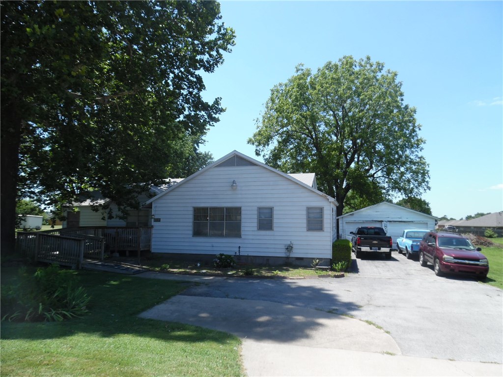 Great 4 bedroom, 2 bathroom home that is zoned commercial and has about 2 +- acres of land that will need to be split from existing tract. Home is in good condition, with large spacious rooms and move in ready with many possible uses. An additional 1.29 acres could be sold with the property. Home is being sold as is. Also see MLS#1122090 & 1122092.