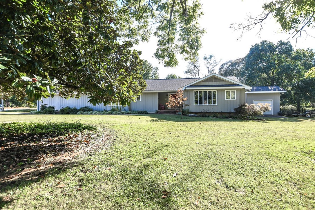Well maintained home at the end of a cul-de-sac means no thru traffic, seclusion & privacy! Flint Creek is just steps away. Yard is truly park-like. Outdoor entertaining will be a breeze under the covered deck, complete with 2 pergolas and a new swim spa! Lush landscaping surrounds the home. New exterior paint in 2019. This charming, single level home offers large rooms with built-ins throughout, including 2 primary bedrooms with en-suite full baths and an additional 3rd bedroom with a full guest bath - updated. Big kitchen with ample cabinetry, counterspace, bar & breakfast/eat-in area. Laundry has all you need with cabinets, counterspace, sink and doubles as a mudroom right off the oversized garage. Natural light flows easily throughout the whole house. Hardwood floors, tile & vinyl flooring - no carpet. All appliances convey including the refrigerator, washer & dryer. 3rd garage has electricity, workbench and loft area, can be a workshop, mancave or use for extra storage. Swim spa to convey w/ acceptable offer.
