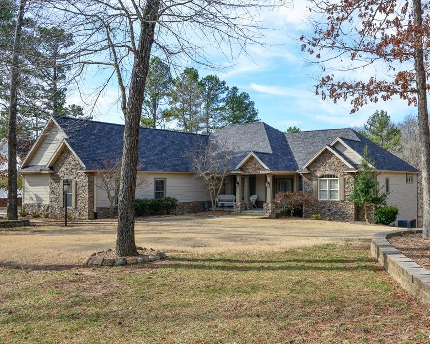 Lake front paradise on Beaver Lake with 2 slips in a semi private boat dock. This spacious immaculate and impeccably maintained home is a rare find this close to town. Flat backyard, large eat-in kitchen, two living spaces, numerous built-ins and just steps to the water. New roof 2019, newly painted exterior and new 75 gallon hot water heater. In wonderful neighborhood. This house is ready for the best summer of your life.