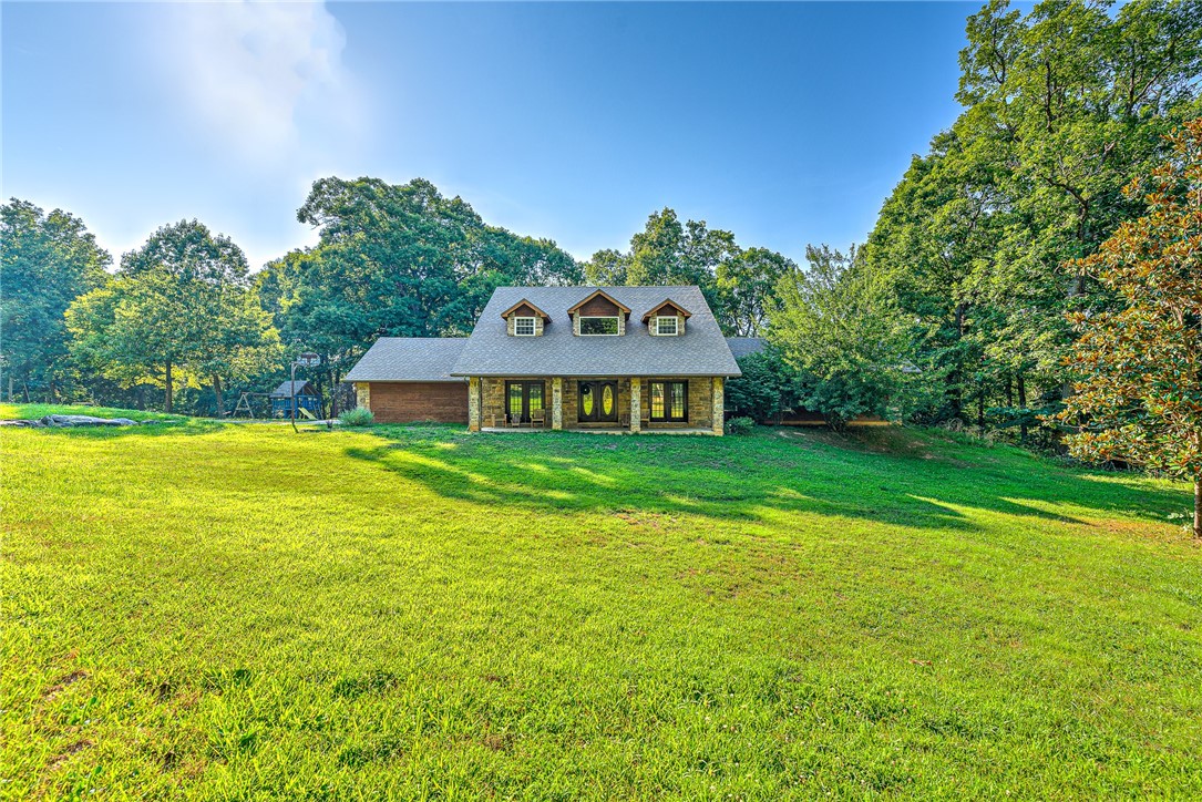 You have found your home in the woods! Room to roam and be by yourself or come together in multiple living spaces. This could be a primary residence, weekend retreat for extended family, or holiday rental. Heat is by wood-fired boiler, cook top is propane, everything else is electric. Roof is less than two years old.