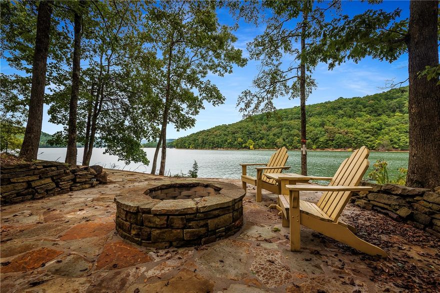 This stunning property offers all the dream lakefront features! The spacious home welcomes you with light airy rooms, high ceilings, open floor plan and designer finishes. The elevator allows everyone easy access to all 3 levels. Expansive outdoor spaces invite you to enjoy the lake at every opportunity and the low corp line gives easy access to the private 4 slip dock and the waterfront and firepit area. See attached features sheet for full list of amenities