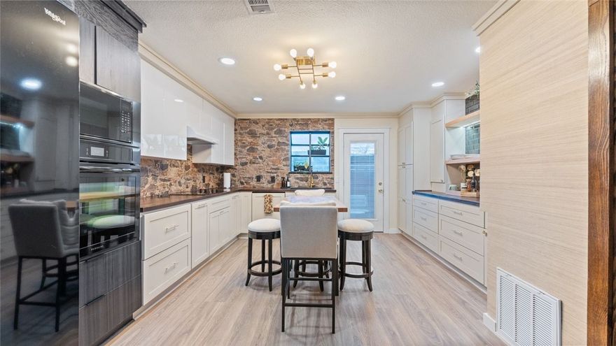 This stunning 2-bedroom, 1-bath townhome offers 900 sq ft of stylish, modern living and was completely remodeled at the end of 2023—no detail spared. Enjoy a bright, open-concept floor plan with brand-new flooring throughout and all-new appliances. The kitchen shines with new countertops, tile, and a sleek design perfect for entertaining or everyday living. Both bedrooms feature custom built in closets and new vanities, while the beautifully updated bathroom includes new tile, tub, and shower. For added convenience, the washer and dryer have been relocated upstairs. A fantastic opportunity for a University of Arkansas student, investor, or Airbnb buyer seeking a truly move-in-ready property. The property is currently scheduled to be available in August; however, a strong, well-structured offer could allow for earlier availability. Ring doorbell and appliances convey.