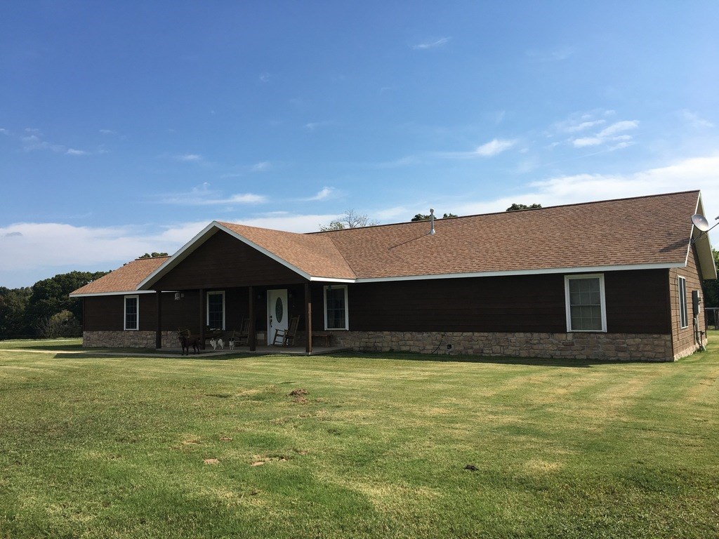 Beautiful country setting! Lots of pasture with some timber. Home has tile and new laminate in master. home is very well insulated. Large pond with mature trees provide water and shade for livestock. 1200 sq ft shop with electricity and water.