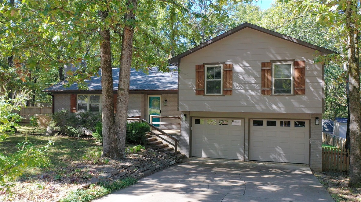Welcome to 3193 N Katherine Ave. This beautiful East Fayetteville home is located in the Huntington Subdivision and has 3 bedrooms and 2.5 Baths. Location is convenient to shopping, restaurants, parks, trails, Botanical Gardens, and is a short walk to Butterfield Elem via the Raven Trail. Home has been extensively remodeled. Updates include a new custom kitchen, new laundry room, new primary bathroom, custom mudroom, wood laminate throughout and new paint. Other amenities include bonus living space perfect for an office, den or playroom, Home has a new roof (2020), new water heater (2020, new furnace (2022), new insulated garage door (2022), new Kitchenaid dishwasher (2023). Home has also had extensive upgrades to the foundation and to the drainage. Foundation work has a transferable lifetime warranty. The neighborhood has a wonderful pavilion/pool house and a newly renovated saltwater pool. The new trail system runs through the neighborhood and connects Mud Creek Trail and Gulley Park. This home is a must see.