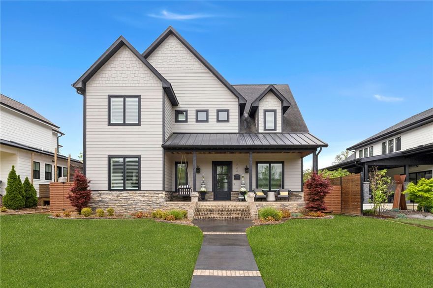 Located just off the Square this residence is designed for those who want to experience an "inside-out" living.  The architecture centers on a unique courtyard flow, using glass garage doors on both levels to erase the boundary between the home and the outdoors.  The heart of the home connects the main living area to the garage through a central breezeway.  The glass door is raised, the space expands into a private courtyard featuring an outdoor kitchen with multiple grills and a fireside seating area.  This level also holds the primary suite and a dedicated office with a stained tongue and groove ceiling.  The second floors mirrors the open-air concept.  An expansive living area, complete with a fireplace and full bar, opens via glass doors to a breezeway - a place to mediate, exercise or watch a game while enjoying the fresh air.  The breezeway provides a covered connection between a fully independent apartment. This layout ensures privacy for guests while maintaining a direct link to the main house.