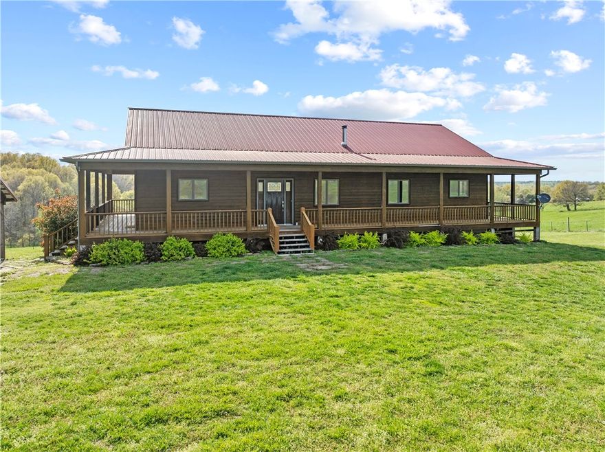 Discover the perfect blend of comfort, style, and functionality on this stunning 56.2-acre property nestled in the heart of the Ozarks. This spacious 3-bed, 3-bath home offers 3,480 sq ft of beautifully designed living space, including a fully finished basement—perfect for a second living area, entertainment space, or guest suite.
The heart of the home is the chef’s kitchen, featuring high-end finishes, a large center island, and ample room for hosting friends and family. Natural light pours in through premium Andersen windows, showcasing the scenic views that surround you.
Step outside to find a property that’s both peaceful and practical. Whether you're a hobbyist, homesteader, or simply enjoy wide-open space, you’ll appreciate the workshop, greenhouse, and gently rolling acreage ideal for animals, gardening, or future expansion. This one-of-a-kind property offers the space, privacy, and versatility you've been searching for—all just a short drive from the amenities of Harrison.