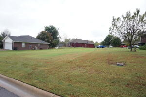 Open, level lot in Millwood Estates. Good location for single residential or duplex.