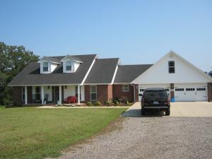 BIG COUNTRY LIVING--BIG CONTEMPORARY ESTATE! Executive dwelling is custom, well designed! Stunning masterpiece is only 4 years old.Tasteful & impressive, home offers large living spaces, designer kitchen, 2 dining areas, loads of windows! 2 family rooms! Bring yourlivestock--pond & pasture! Outlet for Power Generator.