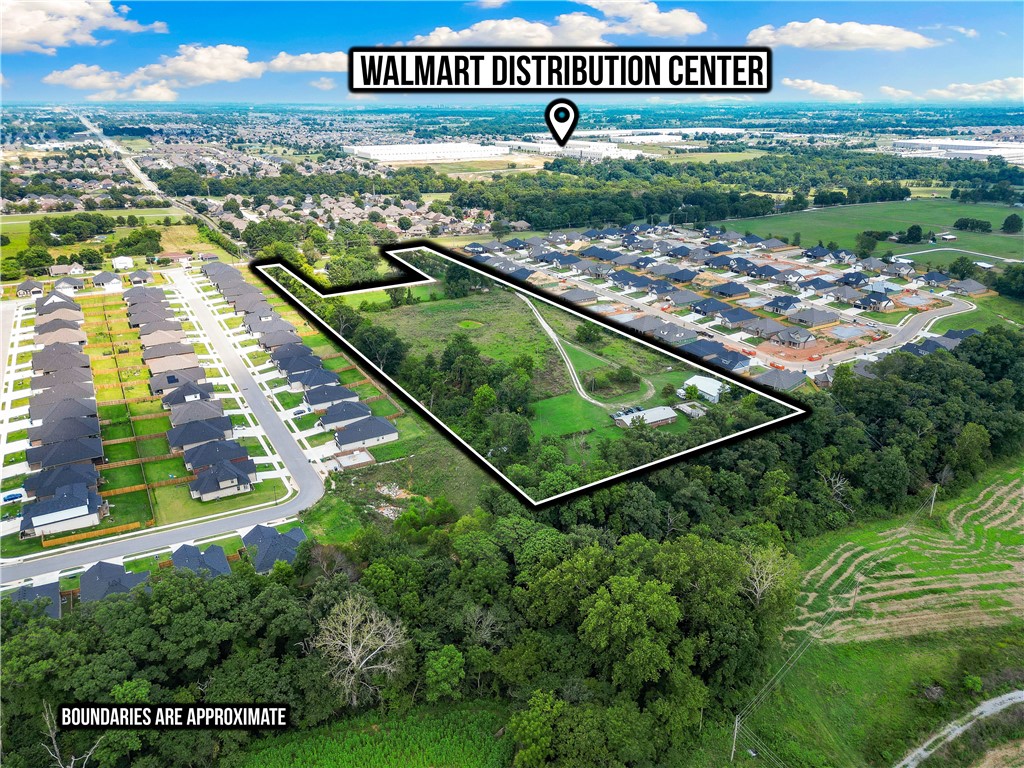 This rare 10-acre parcel offers exceptional potential in one of Bentonville’s fastest-growing corridors. Featuring two income-producing homes, a covered barn, and full utility connections, the property is functional today while you plan for tomorrow. Ideally located just minutes from all that Bentonville has to offer, this tract is perfect for immediate development or long-term investment. Zoning and approvals are already underway. Bring your vision and seize one of the last large, developable properties in the area. Equestrians will appreciate the ample space, covered barn, and ideal setup for horses—making it a perfect home for you and your animals.