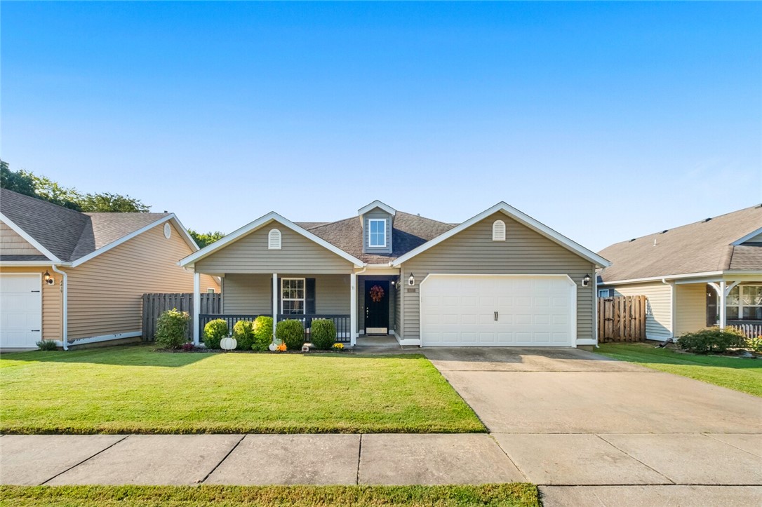 Wonderful well cared for 3 bedroom 2 bath west Fayetteville home. Backs up to the community walking path. Located on the edge of Fayetteville and Farmington, just a few minutes to I-49, shopping, schools, restaurants, and a neighborhood park. Open kitchen with breakfast seating and separate area for dining. Living room has a cozy fireplace and lots of natural light. Enjoy the screened porch with a view of the walking trail just beyond the wood privacy fence.