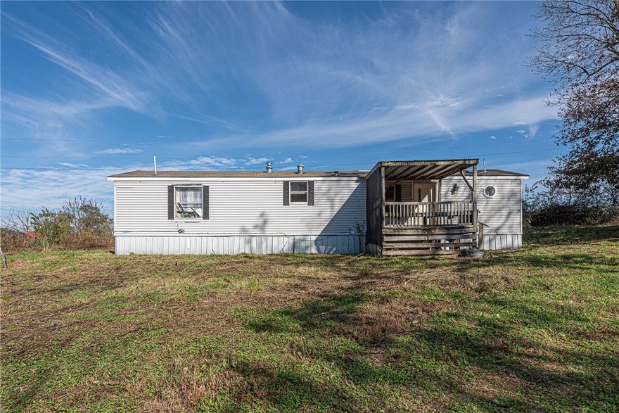 RENOVATE the existing manufactured home OR BUILD YOUR DREAM HOME! Are you looking for a location to place some roots and build your dream home or hobby farm? Look no further! This gently rolling property on 2.05 acres +/- is just what you have been waiting for! Located approx 15 min to downtown Lincoln & Prairie Grove while being 30 min to Fayetteville & Siloam Springs! Mature trees provide privacy! Electricity and water on site! Endless possibilities you don’t want to miss out, Act Now! **Seller has no knowledge of the existing septic system buyer to independently verify septic, property is sold as-is where-is with all faults*** Also listed as land, see MLS #1327176