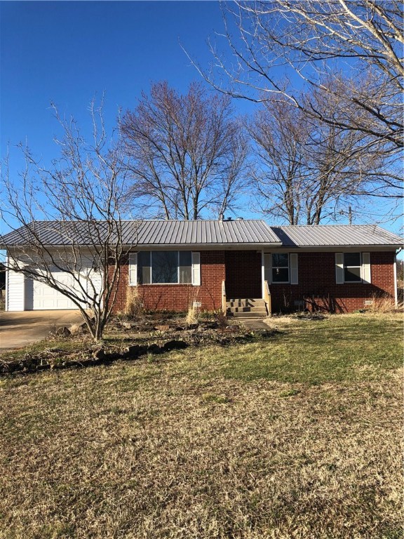 Fixer upper on 2.27 acres with 30' x 40' shop building, mostly brick, pool needs new liner. Nice fireplace with insert. Rare find! Not many properties for sale with 2.27 acres and large shop.