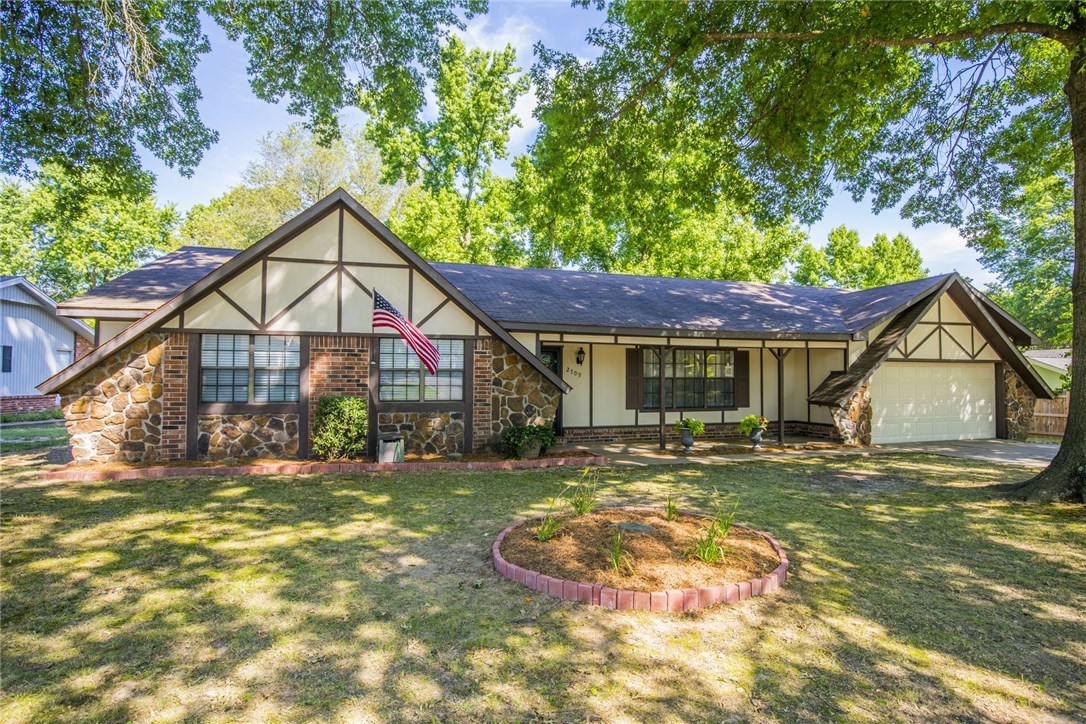 Beautiful established remodeled home in West Rogers. 3 Bedroom 2 Baths with an open floor plan in the main living, dining, and kitchen area. Nice wood floors throughout with carpet in the bedrooms. A/C unit is less than 2 years old. Gorgeous large back yard with large oak trees for tons of shading. Full privacy wood fence with double gates on the side. Painted cabinets with nice modern neutral color scheme. Kitchen has nice white subway tile with white countertops and a nice window over the sink for a view to the backyard. All interior doors have been replaced, upgraded lighting fixtures, as well as door handles and hardware. Great fireplace in the living area for cold cozy nights. Sit on your covered front porch or your large covered patio in the backyard. There's a bonus covered partially enclosed structure that could be used for multiple purposes. Close to shopping, dining, and entertainment. Also super close to the Rogers bike trails. Don't miss out on this rare find at this affordable price point.