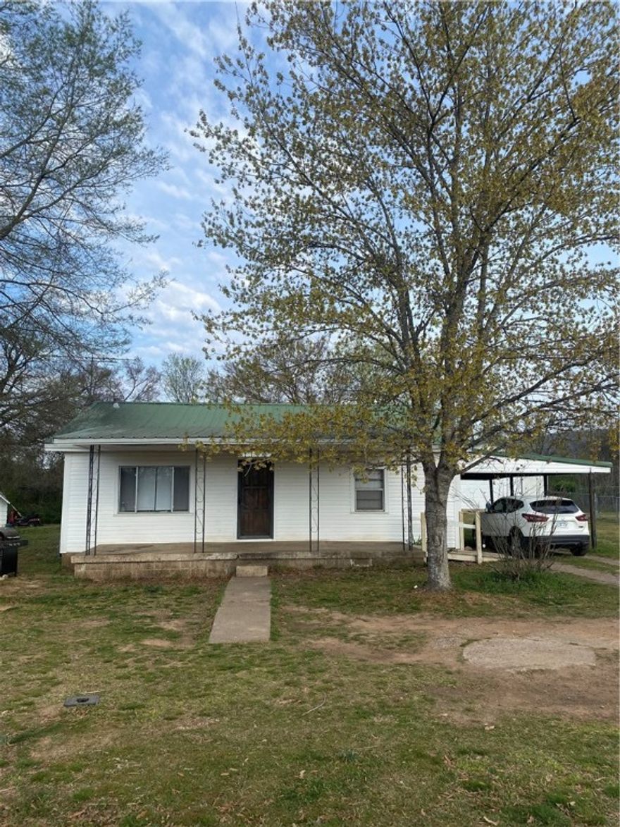 Charming home with original hardwood flooring, large eat-in kitchen and plenty of space for a garden.  This will make a perfect starter or investment home. Property is near the Arkansas River, near the University of the Ozarks, and has the convenience of nearby shopping but still has the character of life in a small town. Extras include a storm cellar and a storage shed. The washer and dryer convey. Listed below appraisal value. Call today to see schedule your private showing.