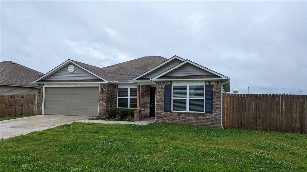 Ranch-style house with brick siding, driveway, an