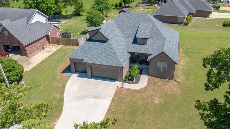 A not to be missed location for outdoor enthusiasts, your new Executive home is in the heart of all the golfing, hiking, & biking in Bella Vista! Located near Hole 14 of Dogwood Golf Course, & along the world famous Back 40 bike trail, your mostly flat location has a large side yard, & backs up to Bella Vista POA. The rare SEWER connection is beside your 3-car garage, where you'll also find additional rocked parking for your guests. Your backyard is ready to host & entertain with your outdoor TV staying, & your plumbed quick connect line on your patio for your gas grill or firepit table. Your massive home boasts 2 large bedrooms & a full bath upstairs, plus a bedroom & full bath downstairs, along with your primary suite on the main floor. Your office, w/ double glass French doors connects to your entry way at the front of your home w/ high ceilings & tons of natural light. Open concept living has your expansive kitchen, dining, & living room combined. Peak all the extras in your new home, that thought of it all!