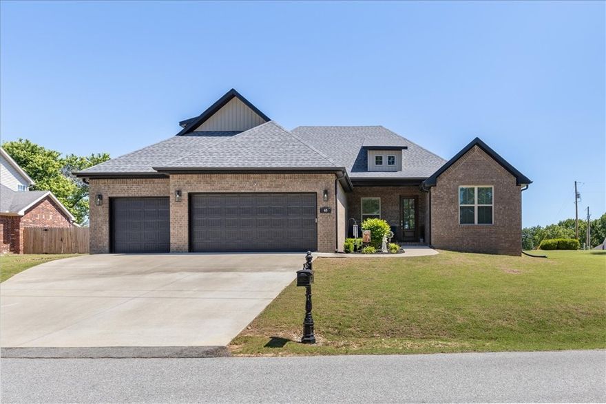 A not to be missed location for outdoor enthusiasts, your new Executive home is in the heart of all the golfing, hiking, & biking in Bella Vista! Located near Hole 14 of Dogwood Golf Course, & along the world famous Back 40 bike trail, your mostly flat location has a large side yard, & backs up to Bella Vista POA. The rare SEWER connection is beside your 3-car garage, where you'll also find additional rocked parking for your guests. Your backyard is ready to host & entertain with your outdoor TV staying, & your plumbed quick connect line on your patio for your gas grill or firepit table. Your massive home boasts 2 large bedrooms & a full bath upstairs, plus a bedroom & full bath downstairs, along with your primary suite on the main floor. Your office, w/ double glass French doors connects to your entry way at the front of your home w/ high ceilings & tons of natural light. Open concept living has your expansive kitchen, dining, & living room combined. Peak all the extras in your new home, that thought of it all!
