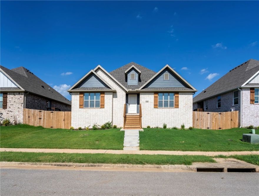 Stunning 4 bed, 2 bath home in southwest Bentonville! This charming home features a brick exterior with wood accents and a welcoming front entry. Inside, enjoy an open layout with wood-look tile floors, tray ceilings, and a cozy gas fireplace. The kitchen includes granite countertops, a center island, stainless steel appliances with gas range, pantry, and ample cabinet space. The primary suite offers a spacious layout, tiled walk-in shower, and double vanities. Outside you’ll find a covered side porch, rear-entry two-car garage, and fully fenced backyard. Located in a desirable neighborhood with sidewalks, nearby parks, and easy access to Bentonville’s extensive trail system, including the Razorback Greenway. Close to schools, shopping, and dining—this home offers comfort, convenience, and modern style in a great location!