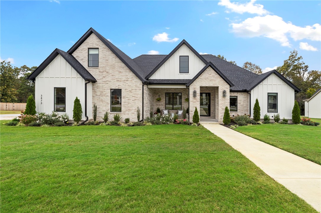 Located in the highly sought after Blackberry Ridge Estates, this meticulously maintained home is one you don't want to miss out on! The main level features a vaulted living room that seamlessly connects to the kitchen. Large Windows flood the space with natural light and offer peaceful views of the wooded backyard! Step outside to the covered patio with a gas fireplace, perfect for cozy evenings year-round! The primary suite conveniently connects to the laundry room. Two additional guest bedrooms and a versatile office/flex space complete the main level. Upstairs offers an oversized bedroom/bonus suite with a full bath, ideal for guest or a private media space! Additional highlights include Epoxy garage floors and an EV charging port! This community features walking trails, a neighborhood pool and pavilion, offering a welcoming and active lifestyle in one of West Fayetteville's premier neighborhoods!