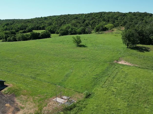 Beautiful property just east of Hindsville Arkansas only 20 minutes to Springdale Arkansas . This property has lots of potential with big pastures, 3 ponds fenced and cross fenced with approx 65% in grass the rest in timber, several nice build sites livestock and hay ready.Property has natural gas ,rural water and electric with high speed internet available .