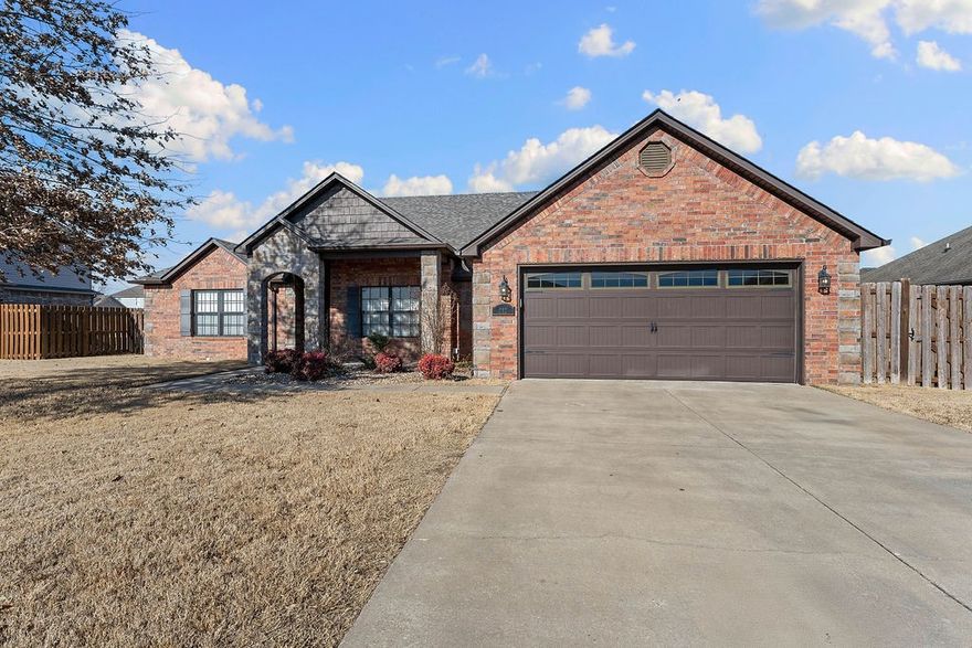 Conveniently positioned between Fayetteville and Bentonville, this thoughtfully designed 4 bedroom, 3 full baths home, offers both comfort and functionality with a desirable split-bedroom floor plan for added privacy.
The open kitchen is the heart of the home, featuring a pantry, breakfast bar, and generous counter space-perfect for everyday living, hosting, and gathering with family and friends. Fresh interior paint and brand-new carpet make this home truly move-in ready! Step outside to your back porch and enjoy a large fully fenced backyard with trees. All of this is located within a desirable gated community, offering added privacy and peace of mind.
This home combines location, layout, and livability—a rare find in today’s market!