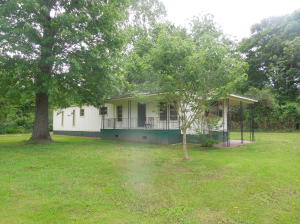 Within walking distance to the park and Little Buffalo River, here's a great opportunity to own a summer home or weekend getaway! Mobile home is on very solid perm concrete foundation and has metal roof. Very nice location and beautiful fenced lot. Livable as is, but with just a few upgrades/update it would really be a nice place!