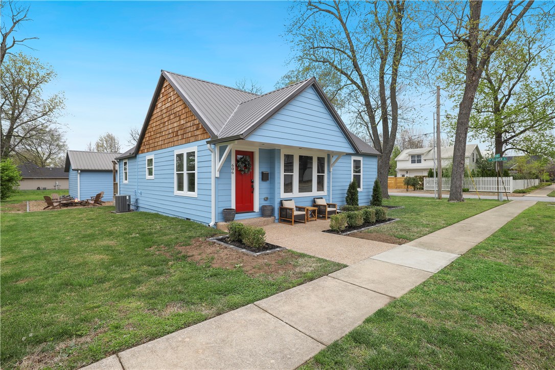 What an amazing opportunity to own a 3 bed 2 bath with bonus space home in downtown Bentonville. Walkable to everything you love downtown this charming home is currently a short-term rental income property loved by both renters and the owners. City of Bentonville pre-approved lot split to allow us to break up the home on the .11 to separate the garage and the home. There is a second listing with the garage and .22 acres ref #1305569. Photo line is approximate.