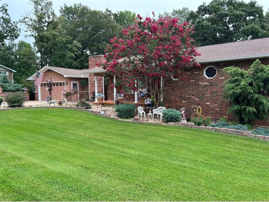 Stunning Brick Home Near Bull Shoals Lake & the White River! Discover your dream home in this beautifully appointed brick residence, situated for those who love the outdoors! Offering 4 spacious bedrooms & 4 baths, this property features an ideal setup for in-law living on the lower level, complete w 2 bedrooms, a bath, a cozy living room, kitchen, laundry room, two hobby rooms, & ample storage. The main floor boasts a welcoming layout w 2 bedrooms & 3 baths, a spacious living/dining area, and a family room enhanced by a charming fireplace. Enjoy the breathtaking views from the fully glassed den, perfect for relaxation or entertaining. Step outside to the expansive composite decking, equipped w built-in light posts for evening gatherings. This home is packed with updates, including stylish vessel faucets and sinks, a luxurious primary bath with a custom shower, a huge walk-in closet, a whirlpool tub, granite countertops, epoxy garage floor, stunning landscaping with bed sprinklers.