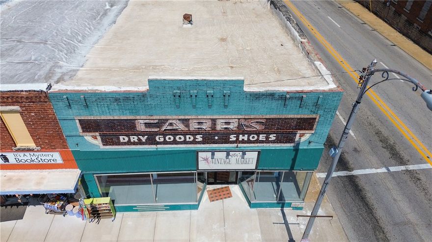 Located on the Berryville Public Square! Originally built in 1900, it features classic architectural charm with modern upgrades. A one-bedroom, one-bath apartment was added in 2021-ideal for an on-site manager, rental income, or Airbnb. With its prime location and visibility, the building offers endless potential for retail, office, event space, or mixed-use development. Whether you're an investor or entrepreneur, this property presents a rare opportunity to make your mark in the heart of Berryville. Zoned commercial.