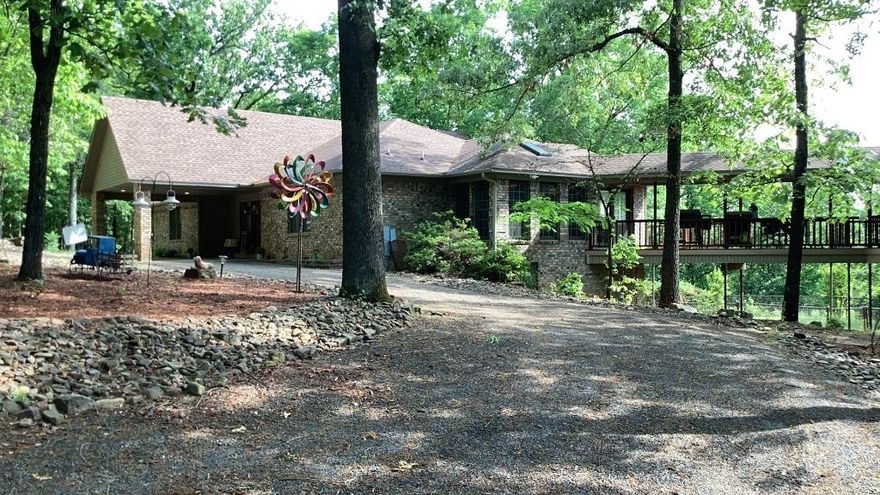 Spacious Custom Home with Mother-in-Law Suite on Nearly 4 Acres!
Welcome to 6 Alexander Lane – a beautifully designed 4-bedroom, 3.5-bath home with a fully equipped mother-in-law suite, nestled on 3.83 wooded acres just minutes from downtown Russellville. 
Inside the main home, you’ll find custom oak cabinetry, a sunken great room with fireplace, formal dining, a bright sunroom/office, and a finished walk-out basement complete with two bedrooms, a game room, full bath, and a secure storm-safe room. The upstairs features two additional bedrooms and a spacious kitchen with built-ins and breakfast area.
The attached 765 sq ft mother-in-law suite includes its own deck access.
Step outside and enjoy peaceful wooded views, a drive-through carport, oversized 2-car garage, and additional storage/workshop space. 
This is a rare opportunity for multigenerational living or a luxury retreat in the heart of the River Valley.