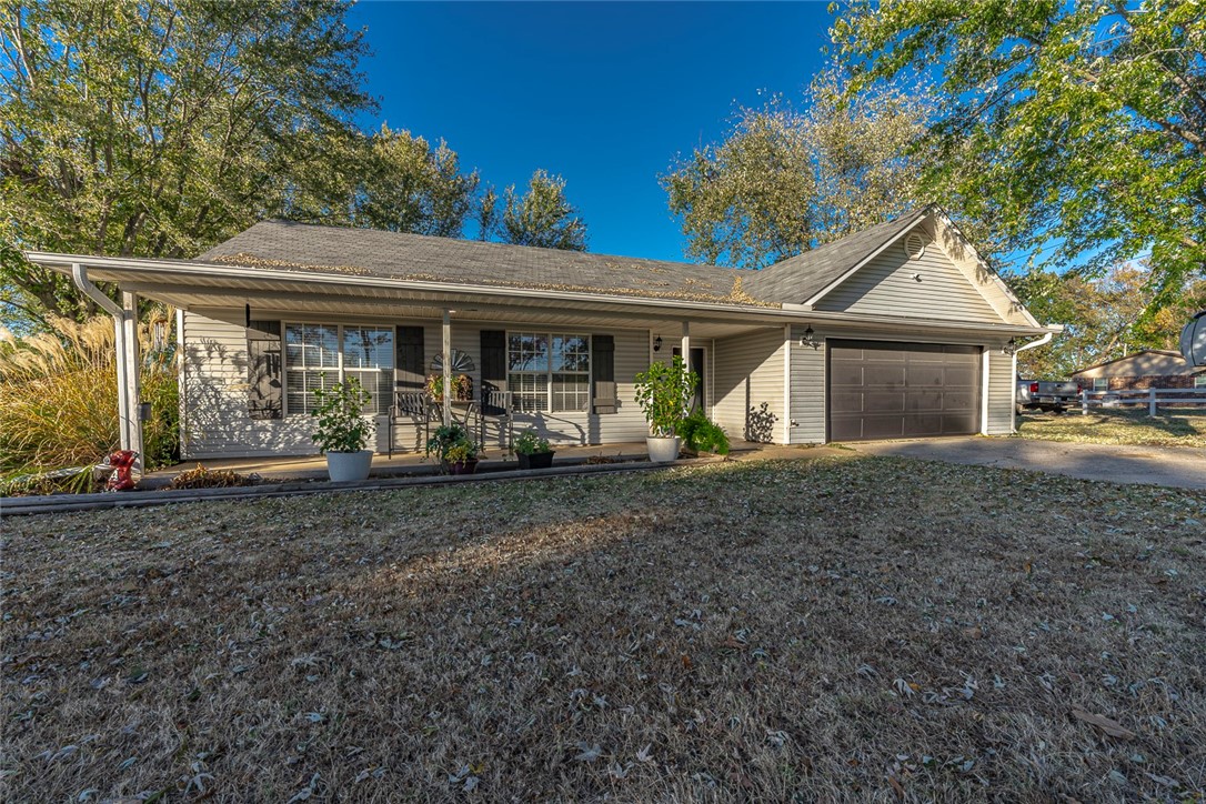 Quiet country living on 2 acres and just minutes to Fayetteville. This adorable home features a 3 bedroom split plan with a large living room, dining area, updated kitchen, and a beautiful master suite with a newly remodeled master bath. Enjoy your coffee on the covered front porch or host a BBQ in your back yard under the pergola. The back pasture is already fenced and ready for your own hobby farm.