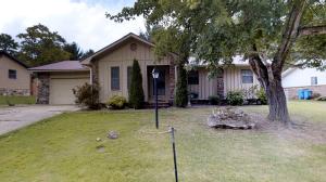 Cozy one level 3 bedroom 2 bath home. Stone fireplace with gas logs, metal roof, fenced back yard, almost new CH&A, 2 car attached garage, 1514 sq. ft.