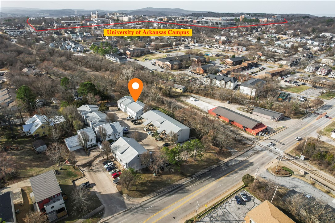 Location, location, location! 36 Unit Apartment Complex for sale located 0.6 miles (appx 15 minute walk) from the University of Arkansas which recorded an enrollment population of 33,610 in September 2024, also 0.3 miles (appx 6 minute walk) from Wilson Park which features multiple sports courts/playground/public pool, and 0.2 miles (appx 4 minute walk) from the nearest Razorback Greenway Trail access (at Frisco Trail) which connects 40 miles of multi-use paved pathways. Multiple floorplans including 15 studios, 4 one bedrooms, 9 two bedrooms, and 8 three bedroom townhomes (attached garages are included at the 3 bedroom townhomes). Units are well-maintained and always in demand. Occupancy is usually 97-100%, rarely are there vacancies. This is a unique opportunity to purchase a turn-key property in one of the hottest rental locations in Arkansas.