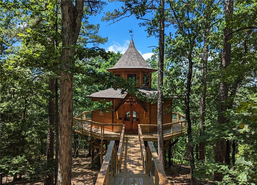 Enchanted Treehouses is a popular luxury treehouse resort offering six custom treehouses and an office surrounded by 52 acres of park-like woods. Each treehouse comes beautifully furnished and has a stone fireplace, Jacuzzi for two surrounded by windows to take in the views, a separate bathroom with walk-in shower, king-sized bed, kitchenette stocked with dishes and cookware, an apartment-sized fridge, microwave, electric counter cooktop and coffee pot, gas grill on the back deck, cable TV and Wi-Fi. Infrastructure is in place for four more treehouses and two platforms have been built with architectural plans for two-story treehouses. You'll enjoy the seclusion and unrestricted land to expand. Live on site in the office or build a home on the property. The perfect terrain to create a trail system and close to trails at Leatherwood and Black Bass parks. Ideal location to expand into the wedding business. Fantastic website and 75,000 Facebook followers. Take the trolley 1.5 miles to downtown shopping and dining.